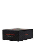 A black rectangular product box with red and white text reading 'TRIM RESTORE AND PROTECT' on a light gray studio background.