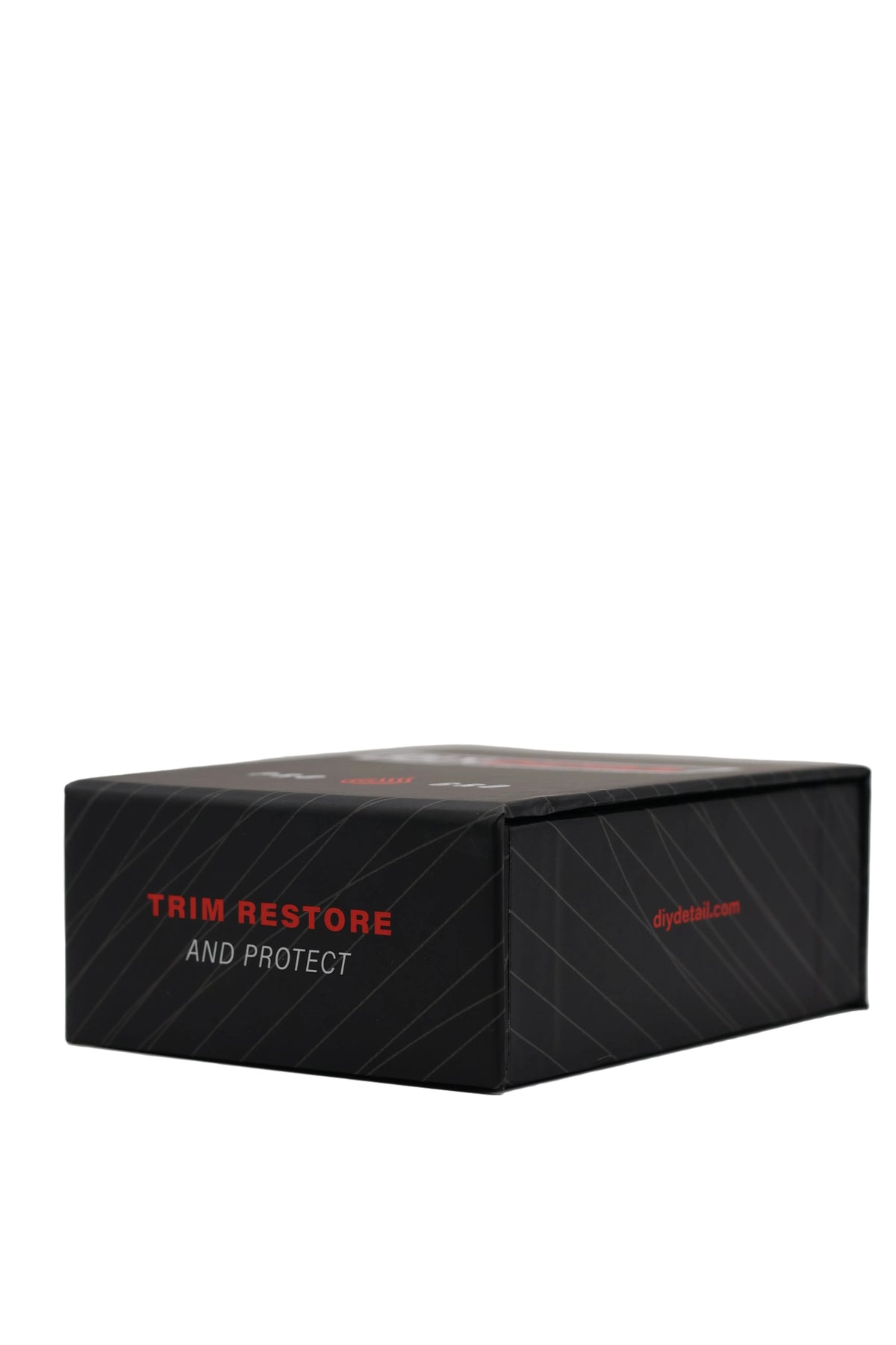 A black rectangular product box with red and white text reading 'TRIM RESTORE AND PROTECT' on a light gray studio background.