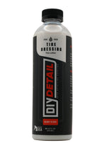 A bottle of DIY Detail Tire Dressing Tire Lotion on a light gray background. The bottle is white with a black cap and a black label featuring red and white text.